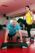 Couple working out in a fitness gym