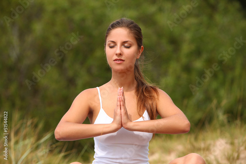 Photo: Beautiful woman enjoy yoga at forest Beautiful woman enjoy yoga at forest