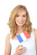 Pretty young woman holding a French flag