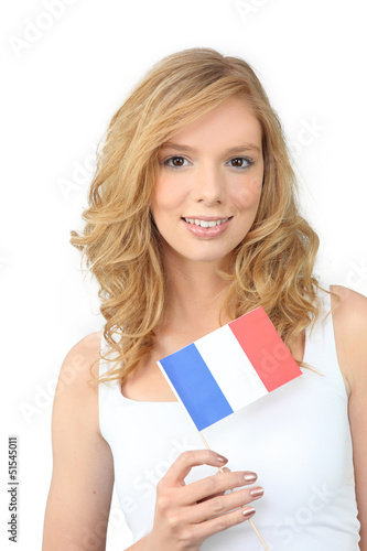 Photo: Pretty young woman holding a French flag Pretty young woman holding a French flag