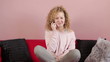 Young girl talking on a mobile phone, tracking shot