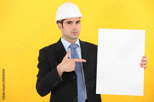 Photo: Engineer pointing to a sign Engineer pointing to a sign