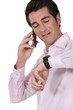 Businessman consulting his watch