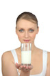 Woman holding a glass of milk