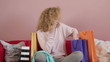 Woman with shopping bags talking on mobile phone