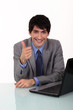 Businessman giving the thumbs up