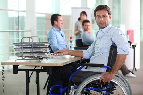 Photo: Working man in wheelchair Working man in wheelchair