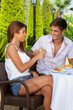 Photo: Couple in love toasting outdoors in a warm day Couple in love toasting outdoors in a warm day