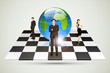 Businesspeople standing around Globe on Chessboard