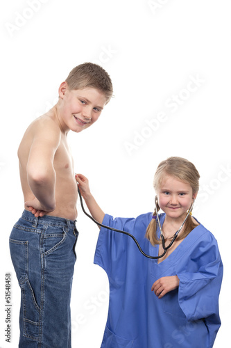 Photo: playing doctor with stethoscope playing doctor with stethoscope