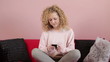 Young woman sending sms