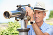 Photo: Senior man looking through a telescope Senior man looking through a telescope