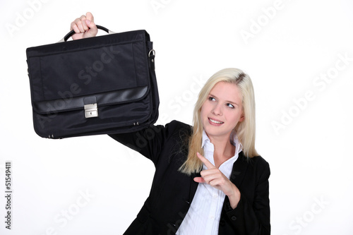 Photo: businesswoman holding a brief case businesswoman holding a brief case