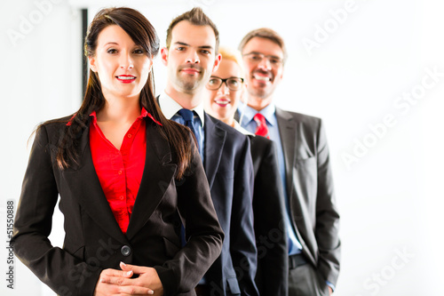 Photo: Business - group of businesspeople in office Business - group of businesspeople in office