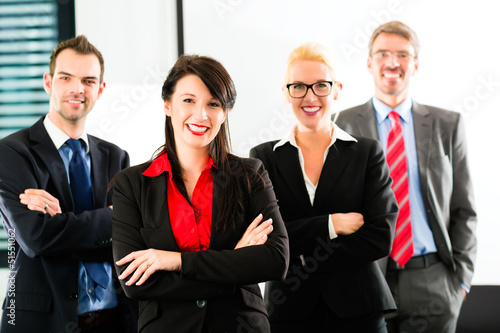 Photo: Business - group of businesspeople in office Business - group of businesspeople in office