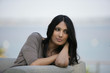 Photo: Woman on an outdoor sofa Woman on an outdoor sofa