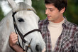 Foto: Young man with a horse Young man with a horse