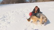 Beauty woman with dog in winter country