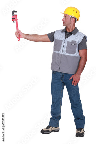 Photo: craftsman holding a spanner craftsman holding a spanner