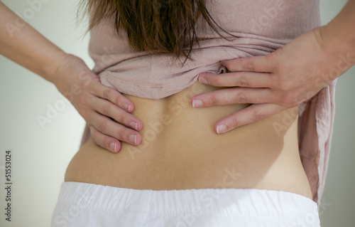 Photo: woman with pain in back woman with pain in back