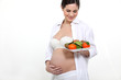 Photo: Pregnant woman eating healthily Pregnant woman eating healthily