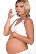Foto: Pregnant woman drinking glass of water Pregnant woman drinking glass of water