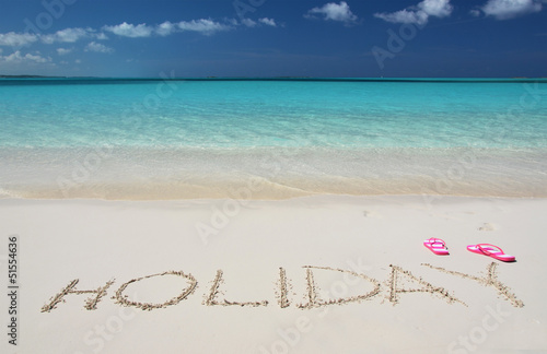 Photo: HOLIDAY writing on the sandy beach of Exuma, Bahamas HOLIDAY writing on the sandy beach of Exuma, Bahamas