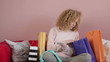 Young woman buying on line with her credit card