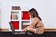 Little girl using a laptop computer