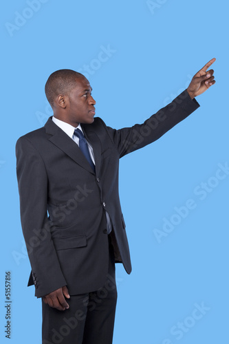 Photo: African businessman pointing African businessman pointing