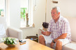 Senior man zapping remote control