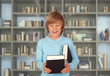 Preteen boy with books for reading