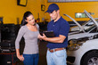 auto mechanic and young woman in workshop