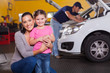 Photo: mother and daughter in garage mother and daughter in garage