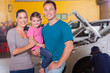 Photo: young family waiting in garage young family waiting in garage