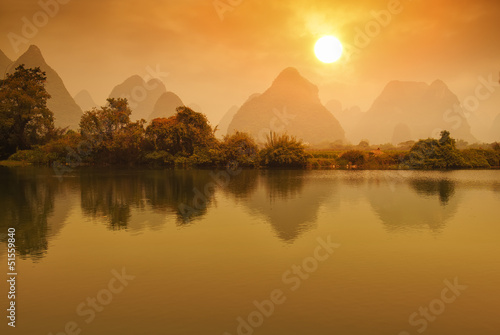 Photo: Sunset landscape of yangshuo in guilin,china Sunset landscape of yangshuo in guilin,china