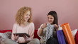 Two young girls sharing their new purchases with each other