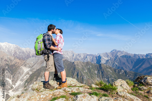 Photo: Couple Kissing at Top of Mountain Couple Kissing at Top of Mountain