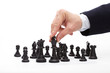 Photo: Business man moving chess figure Business man moving chess figure