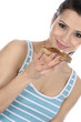 Model Released. Woman Eating Buttered Toast