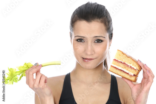 Photo: Model Released. Woman Holding Cake and Celery Model Released. Woman Holding Cake and Celery