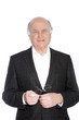 Smiling pensioner holding his glasses
