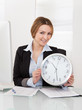 Businesswoman Holding Clock