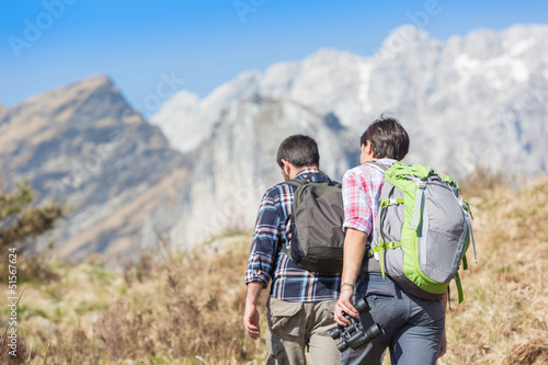 Photo: Young Couple Hiking in the Nature Young Couple Hiking in the Nature