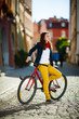 Urban biking - teenage girl and bike in city