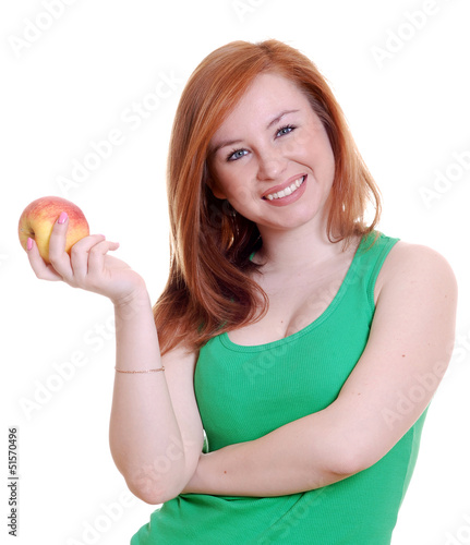 Photo: beautiful young girl with an apple beautiful young girl with an apple