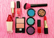 Decorative cosmetics on pink background