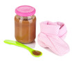 Baby food with baby supplies isolated on white