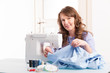 woman using sewing machine