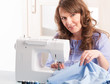 woman using sewing machine